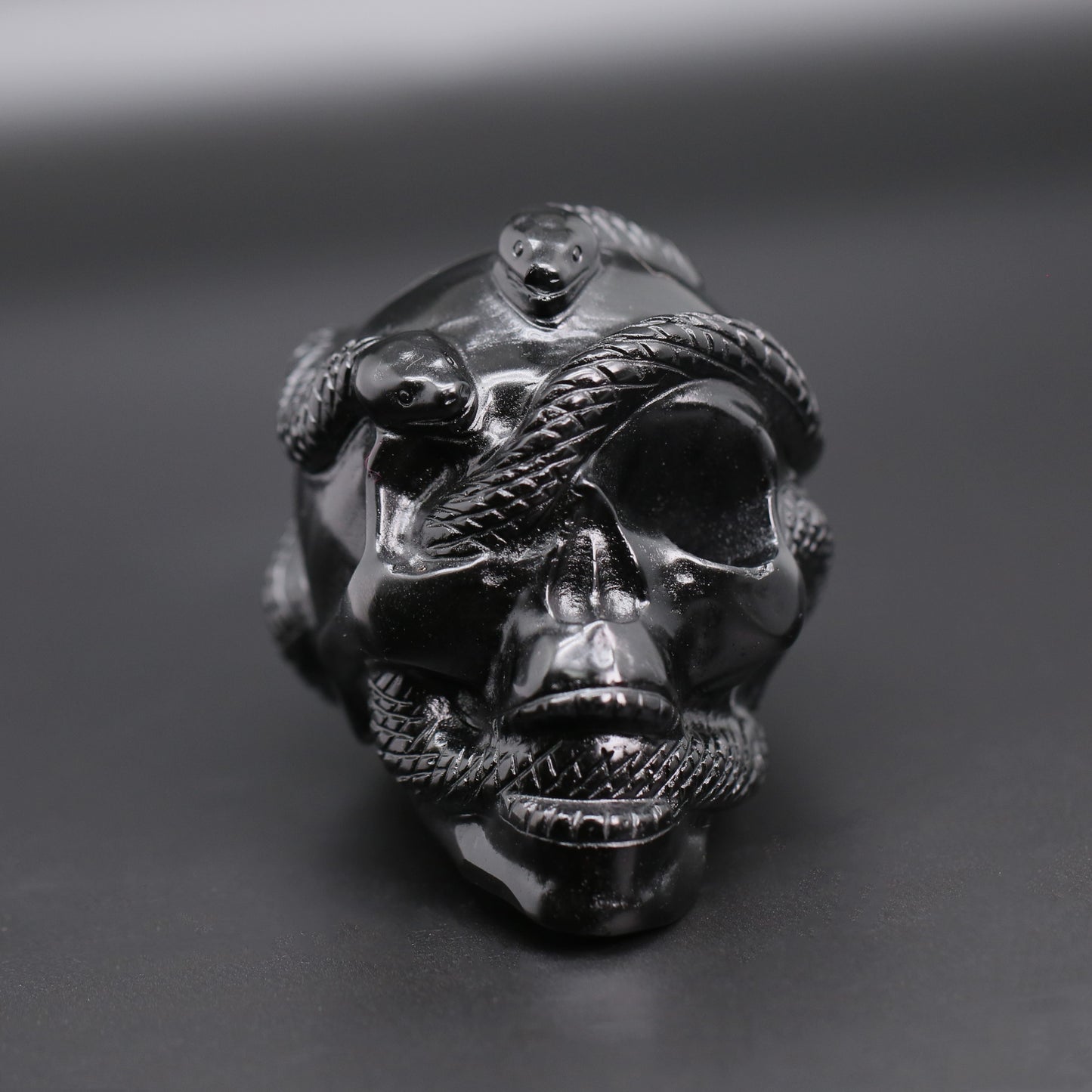 Double snakes obsidian skull