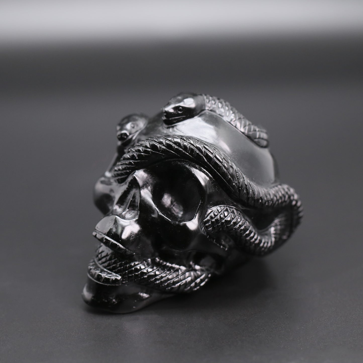 Double snakes obsidian skull