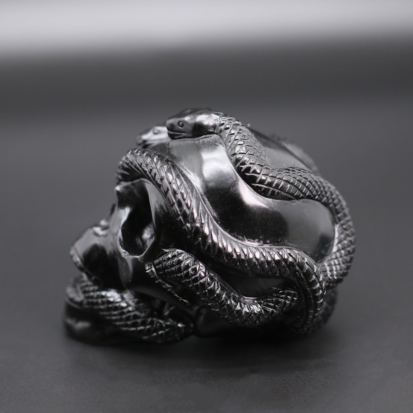 Double snakes obsidian skull