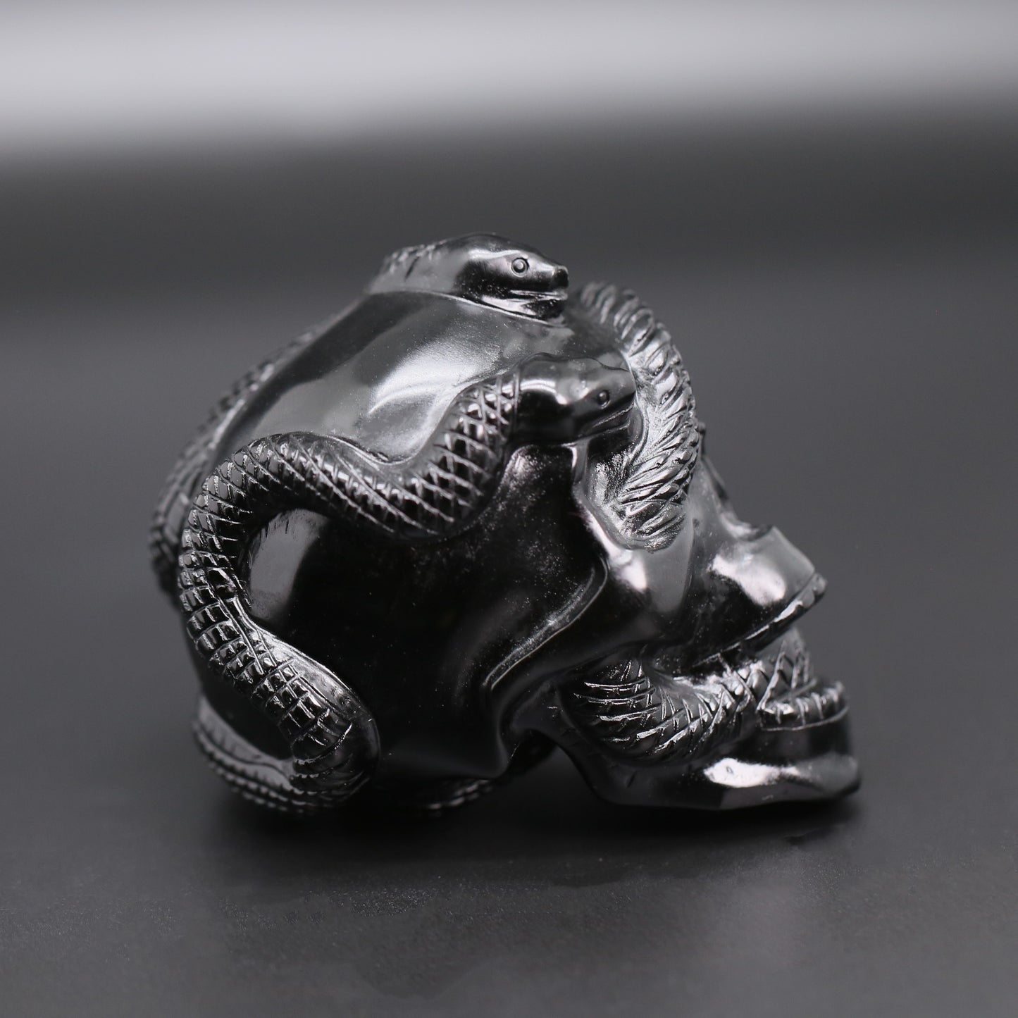 Double snakes obsidian skull