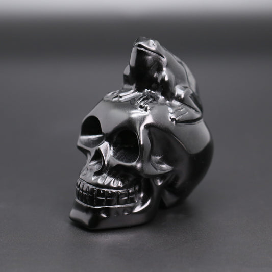 Obsidian skull with frog